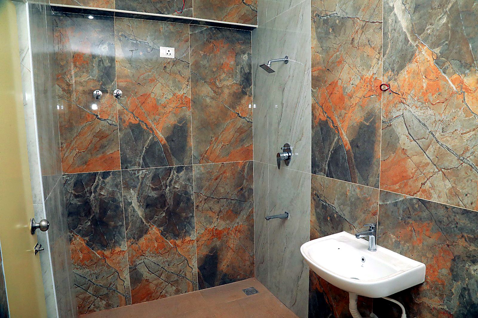Bathroom with marble-finish tiling