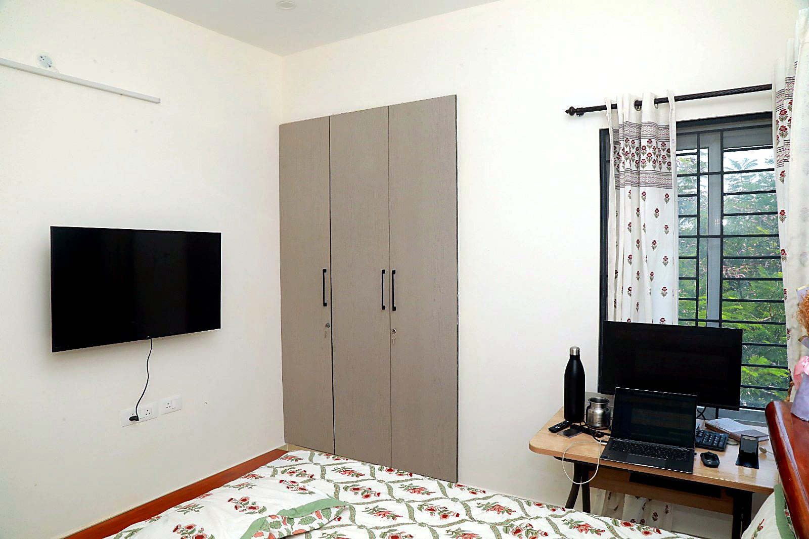 Bedroom with wardrobe and workspace
