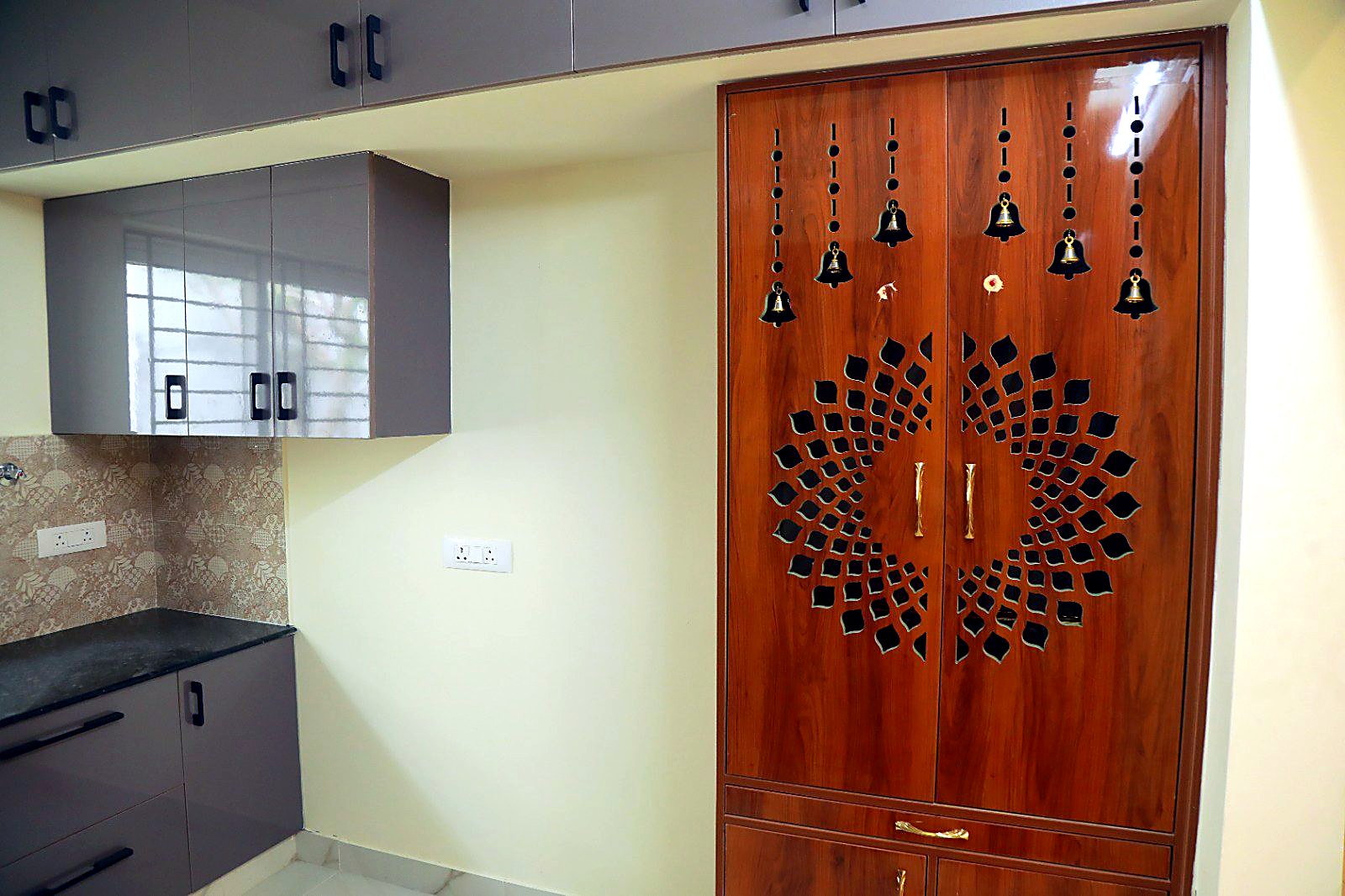 Kitchen with wooden pooja unit